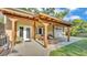 Inviting outdoor patio area with wood beam accents, comfortable seating, and a serene backyard view at 841 E Valencia St, Lakeland, FL 33805