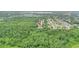Aerial shot of house and neighborhood backing up to green space at 848 17Th Ne Ter, Winter Haven, FL 33881