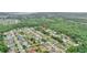 Property aerial view highlighting its location near green spaces, residential areas and a lake at 848 17Th Ne Ter, Winter Haven, FL 33881