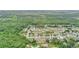 Aerial view shows the property's proximity to lush green spaces and suburban development at 848 17Th Ne Ter, Winter Haven, FL 33881