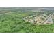 Aerial view highlighting property's location near green spaces and a residential neighborhood at 848 17Th Ne Ter, Winter Haven, FL 33881