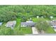 Aerial view of a home nestled among lush greenery and mature trees in a tranquil setting at 848 17Th Ne Ter, Winter Haven, FL 33881