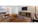 Comfortable living room with a sectional sofa, console table, and modern decor at 848 17Th Ne Ter, Winter Haven, FL 33881