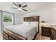 Spacious main bedroom with a large bed, wood floors, a ceiling fan, and ample natural light at 848 17Th Ne Ter, Winter Haven, FL 33881