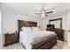 Comfortable main bedroom features a spacious bed, stylish furniture, and a contemporary ceiling fan at 848 17Th Ne Ter, Winter Haven, FL 33881
