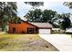 Inviting home with manicured lawn, attached garage, and a spacious driveway at 8504 N Campbell Rd, Lakeland, FL 33810