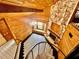 Stunning foyer with spiral staircase, chandelier, stone fireplace, and floor-to-ceiling windows for ample light at 8504 N Campbell Rd, Lakeland, FL 33810