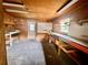Clean and organized garage space with workbenches, storage shelves, and good lighting for various activities at 8504 N Campbell Rd, Lakeland, FL 33810