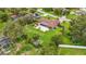 Sprawling backyard with mature trees and lush landscaping, plus a private pool, providing a serene retreat at 8535 Plantation Ridge Blvd, Lakeland, FL 33809