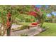 Lush backyard features a relaxing hammock, complemented by beautiful landscaping and serene ambiance at 8535 Plantation Ridge Blvd, Lakeland, FL 33809