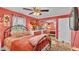 Inviting bedroom showcasing a comfortable bed, complemented by a mirrored closet and natural lighting at 8535 Plantation Ridge Blvd, Lakeland, FL 33809