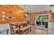 Bright dining area with a slider to the outdoor living space and view of the pool at 8535 Plantation Ridge Blvd, Lakeland, FL 33809