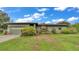 Charming single-story home featuring a well-maintained lawn and landscape, with an attached two car garage at 8535 Plantation Ridge Blvd, Lakeland, FL 33809