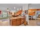 Open-concept kitchen features an island, granite countertops, and seamless flow to the living area at 8535 Plantation Ridge Blvd, Lakeland, FL 33809