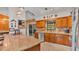 Modern kitchen featuring granite countertops, stainless steel appliances, and an open design for easy socializing at 8535 Plantation Ridge Blvd, Lakeland, FL 33809