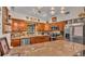 Well-appointed kitchen boasting granite countertops, stainless steel appliances, and ample cabinetry for culinary enthusiasts at 8535 Plantation Ridge Blvd, Lakeland, FL 33809