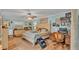 Cozy main bedroom featuring hardwood floors, soft lighting, and an ensuite bathroom at 8535 Plantation Ridge Blvd, Lakeland, FL 33809