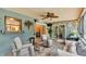 Inviting screened patio offers outdoor relaxation, complemented by comfortable seating and serene views at 8535 Plantation Ridge Blvd, Lakeland, FL 33809
