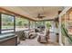 Relaxing screened patio featuring comfortable seating, complemented by pool views and serene ambiance at 8535 Plantation Ridge Blvd, Lakeland, FL 33809