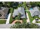 Aerial view of landscaped homes with manicured lawns and mature trees at 943 Hamilton Place Ln, Lakeland, FL 33813