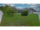 Spacious backyard surrounded by a white fence and lush greenery, creating a private and serene outdoor oasis at 943 Hamilton Place Ln, Lakeland, FL 33813