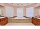Bright bathroom featuring a large soaking tub, granite surround, dual vanities, and tiled flooring at 943 Hamilton Place Ln, Lakeland, FL 33813