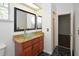 Bathroom with granite counters, cherry cabinets and vessel sink at 943 Hamilton Place Ln, Lakeland, FL 33813