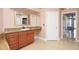 Neutral bathroom featuring tiled flooring, and a vanity with granite countertop at 943 Hamilton Place Ln, Lakeland, FL 33813