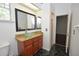 Bathroom features a vanity with a vessel sink and a walk-in shower visible through open door at 943 Hamilton Place Ln, Lakeland, FL 33813