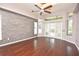 This main bedroom has shiny hardwood floors and a large window to let in tons of natural light at 943 Hamilton Place Ln, Lakeland, FL 33813