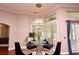 Cozy breakfast nook with a chandelier, corner windows, and seating for four at 943 Hamilton Place Ln, Lakeland, FL 33813