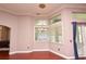 Bright breakfast nook with a chandelier, corner windows and entry to other rooms at 943 Hamilton Place Ln, Lakeland, FL 33813