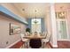 Formal dining room with a table set for eight and a chandelier above at 943 Hamilton Place Ln, Lakeland, FL 33813