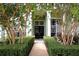 Charming front entrance with meticulously maintained hedges leading up to the front door at 943 Hamilton Place Ln, Lakeland, FL 33813