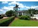 Well-maintained lawn with lush landscaping and a winding driveway, showcasing the home's curb appeal at 943 Hamilton Place Ln, Lakeland, FL 33813