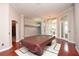 Spacious game room with a pool table, hardwood floors, and lots of natural light at 943 Hamilton Place Ln, Lakeland, FL 33813