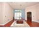 Spacious game room with tile ceiling, wood floors, and a covered pool table at 943 Hamilton Place Ln, Lakeland, FL 33813