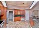 Spacious kitchen boasting granite countertops, ample cabinet storage, and tile flooring at 943 Hamilton Place Ln, Lakeland, FL 33813