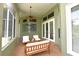 Enclosed lanai with comfortable seating and natural light at 943 Hamilton Place Ln, Lakeland, FL 33813