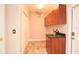 Laundry room with cabinets, sink, tiled floors and closet storage space at 943 Hamilton Place Ln, Lakeland, FL 33813