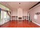 Bright and spacious living room with a fireplace, shelving, and sliding glass doors at 943 Hamilton Place Ln, Lakeland, FL 33813