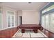 Living room with a view of a pool table, hardwood floors, and a view of the house's entryway at 943 Hamilton Place Ln, Lakeland, FL 33813