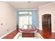 An open-concept living room with hardwood floors, recessed lighting, and a large covered billiards table at 943 Hamilton Place Ln, Lakeland, FL 33813