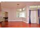 Open living space offers natural light, wood floors, and neutral paint at 943 Hamilton Place Ln, Lakeland, FL 33813