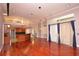 Open concept living space flows seamlessly and features wood flooring at 943 Hamilton Place Ln, Lakeland, FL 33813