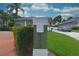 Mailbox and front of the home with well manicured lawn, mature landscaping, and blue skies at 943 Hamilton Place Ln, Lakeland, FL 33813