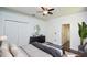 Comfortable main bedroom with hardwood floors, a ceiling fan, and decor at 943 Hamilton Place Ln, Lakeland, FL 33813