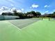 Outdoor tennis court providing recreational opportunities in a vibrant, landscaped community setting at 943 Hamilton Place Ln, Lakeland, FL 33813