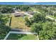 Spacious yard featuring a home, above ground pool, shed, and beautiful green trees at 1034 Shadowbrook N Dr, Lakeland, FL 33813