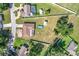 Aerial view of a home with a lot including a shed and an above ground pool at 1034 Shadowbrook N Dr, Lakeland, FL 33813